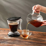 مصفاة شاي والأعشاب مع قاعدة أكواب