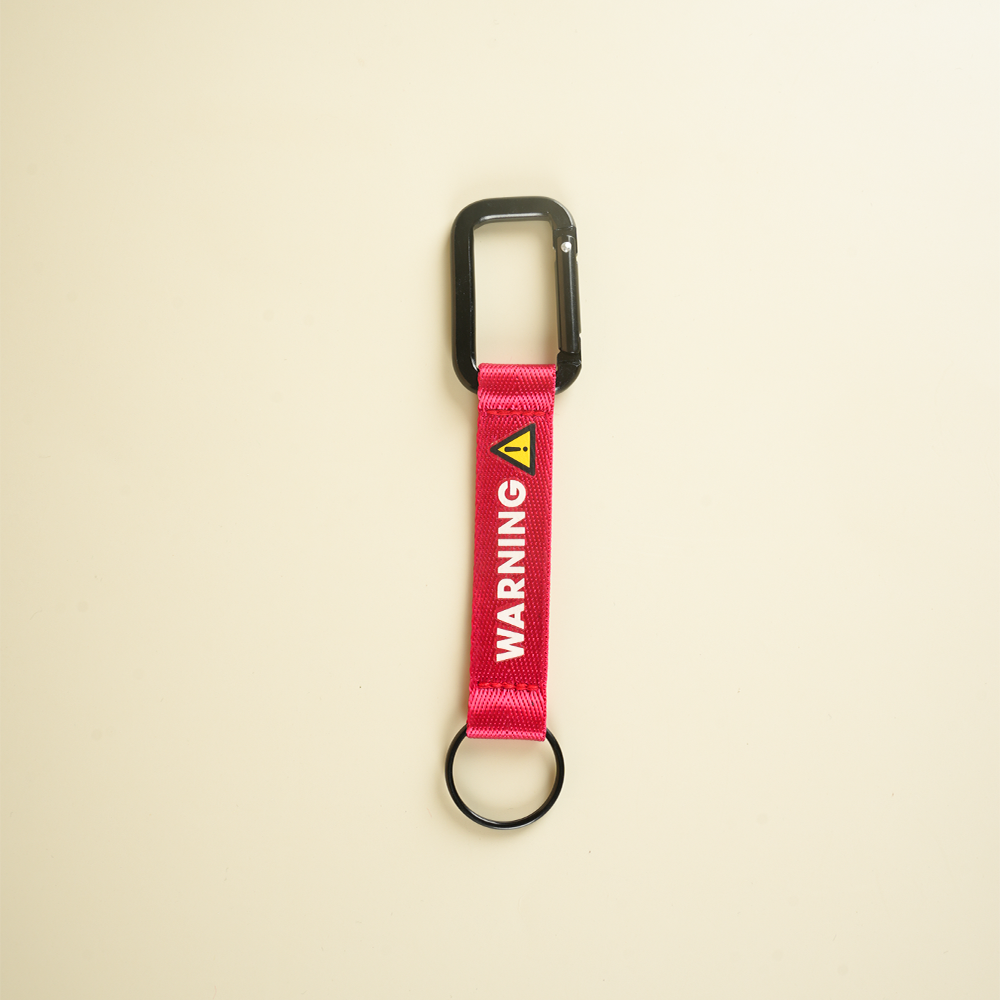 ميدالية مفاتيح WARNING – تصميم جريء لا يمر مرور الكرام